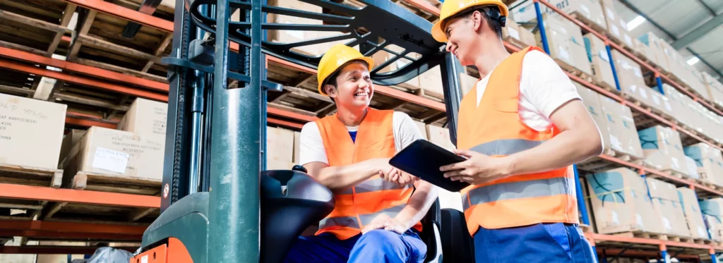 two persons working on foaklift